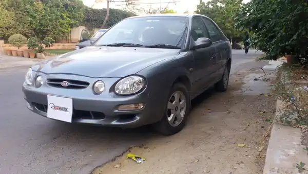 Descargar Manual de Propietario KIA Spectra 2003
