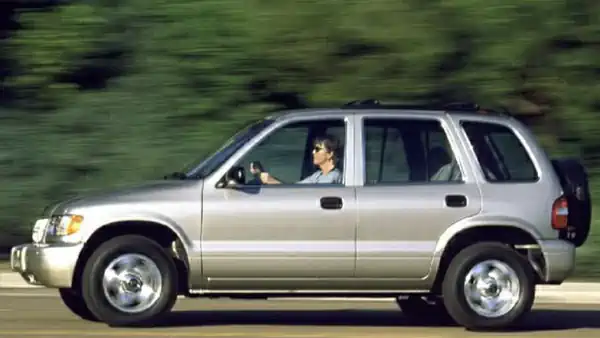 Descargar Manual de Propietario KIA Sportage 2000